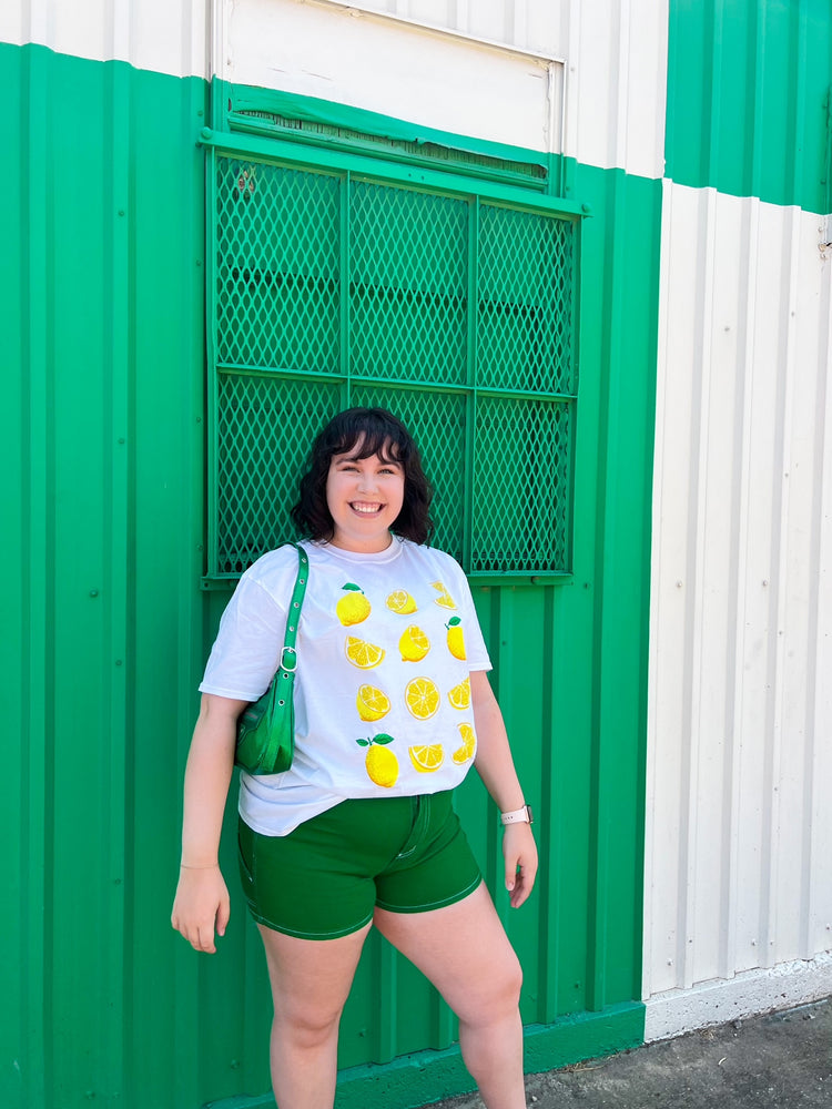 
            
                Load image into Gallery viewer, Tangy Twist Lemon Graphic Tee
            
        