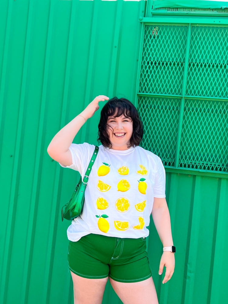 
            
                Load image into Gallery viewer, Tangy Twist Lemon Graphic Tee
            
        